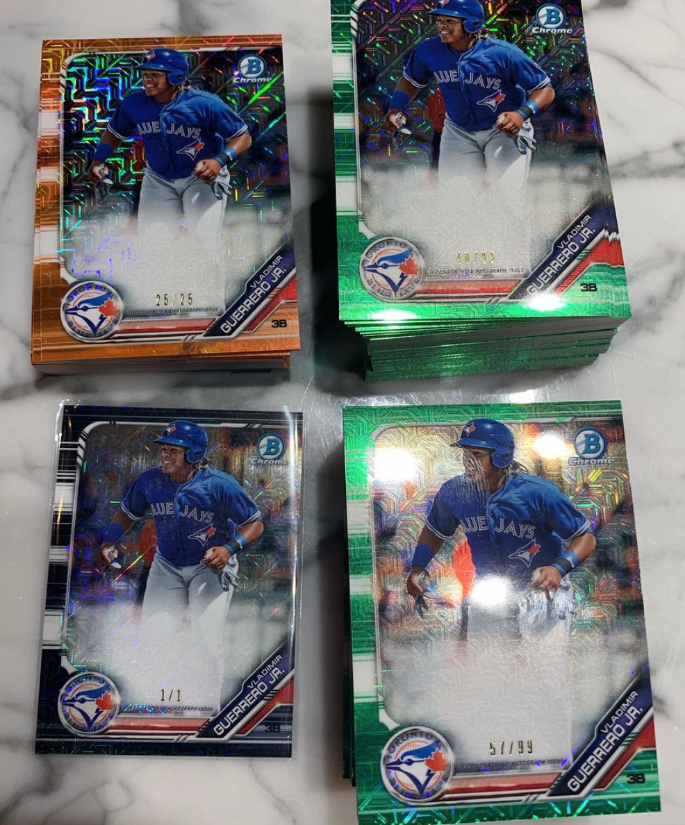 Four stacks of Vlad Jr. sports cards (2019 Bowman Mega - Prospect Auto) on a marble countertop